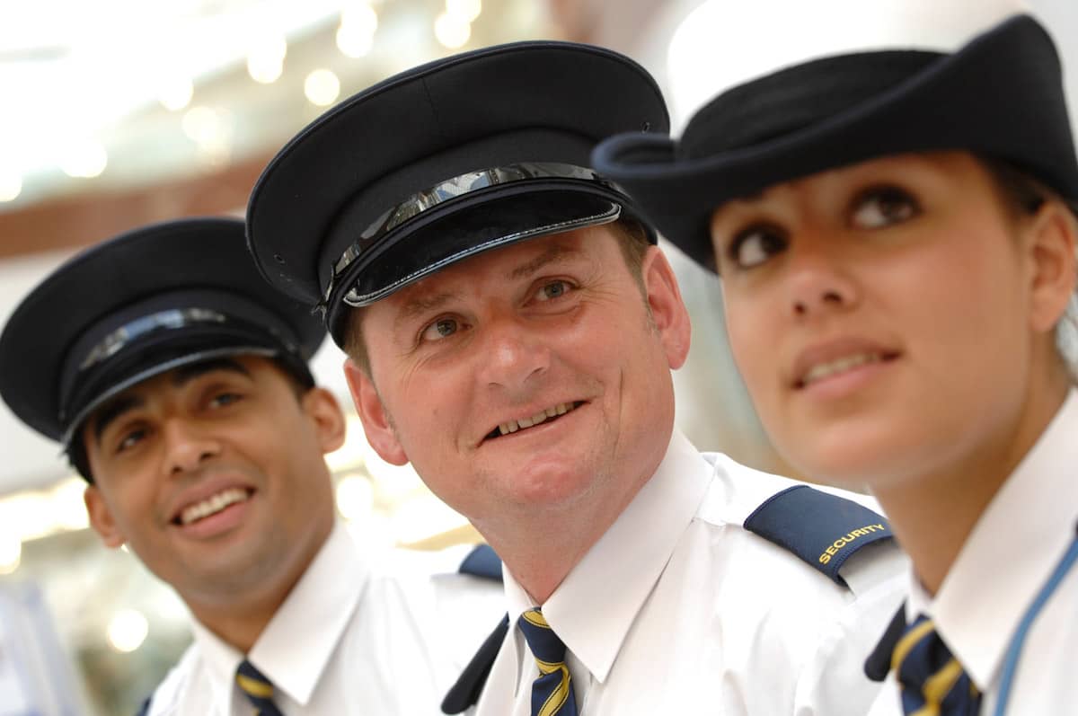 Three people wearing security officer uniform